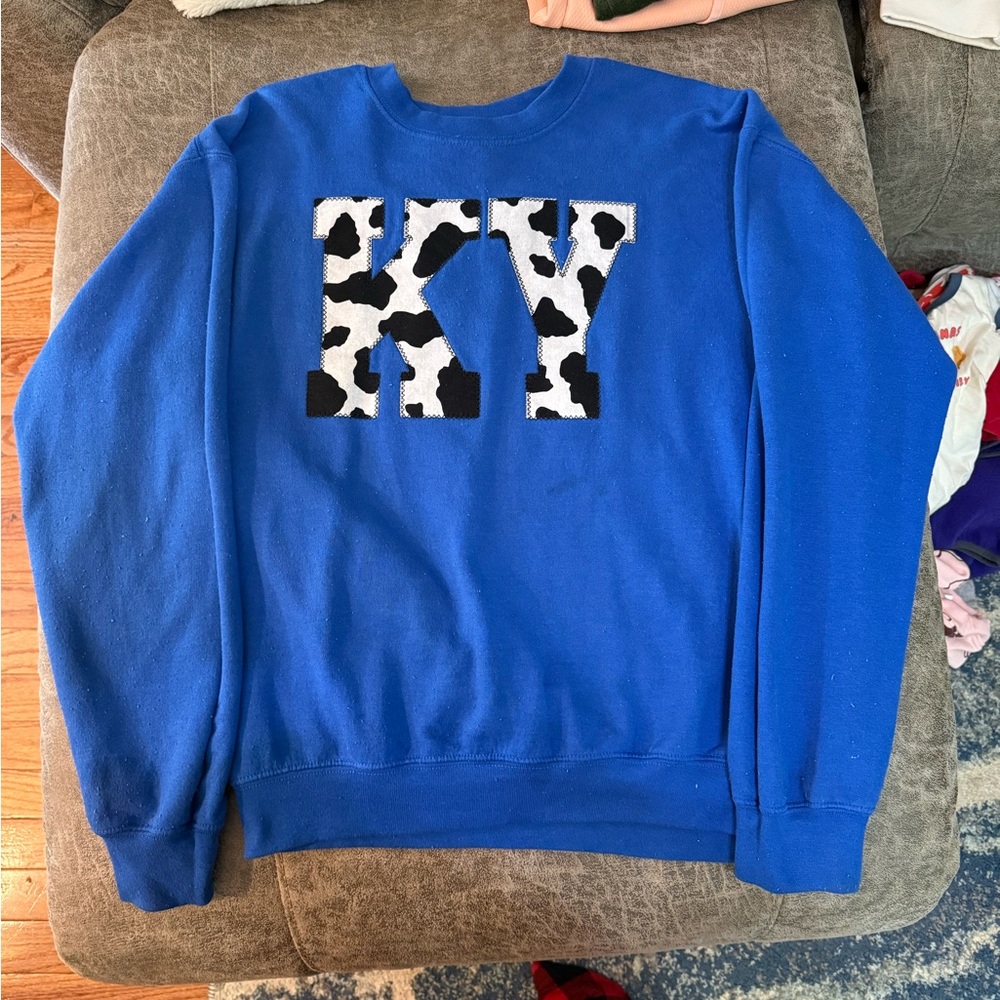 Blue Sweater with Cow Print Design